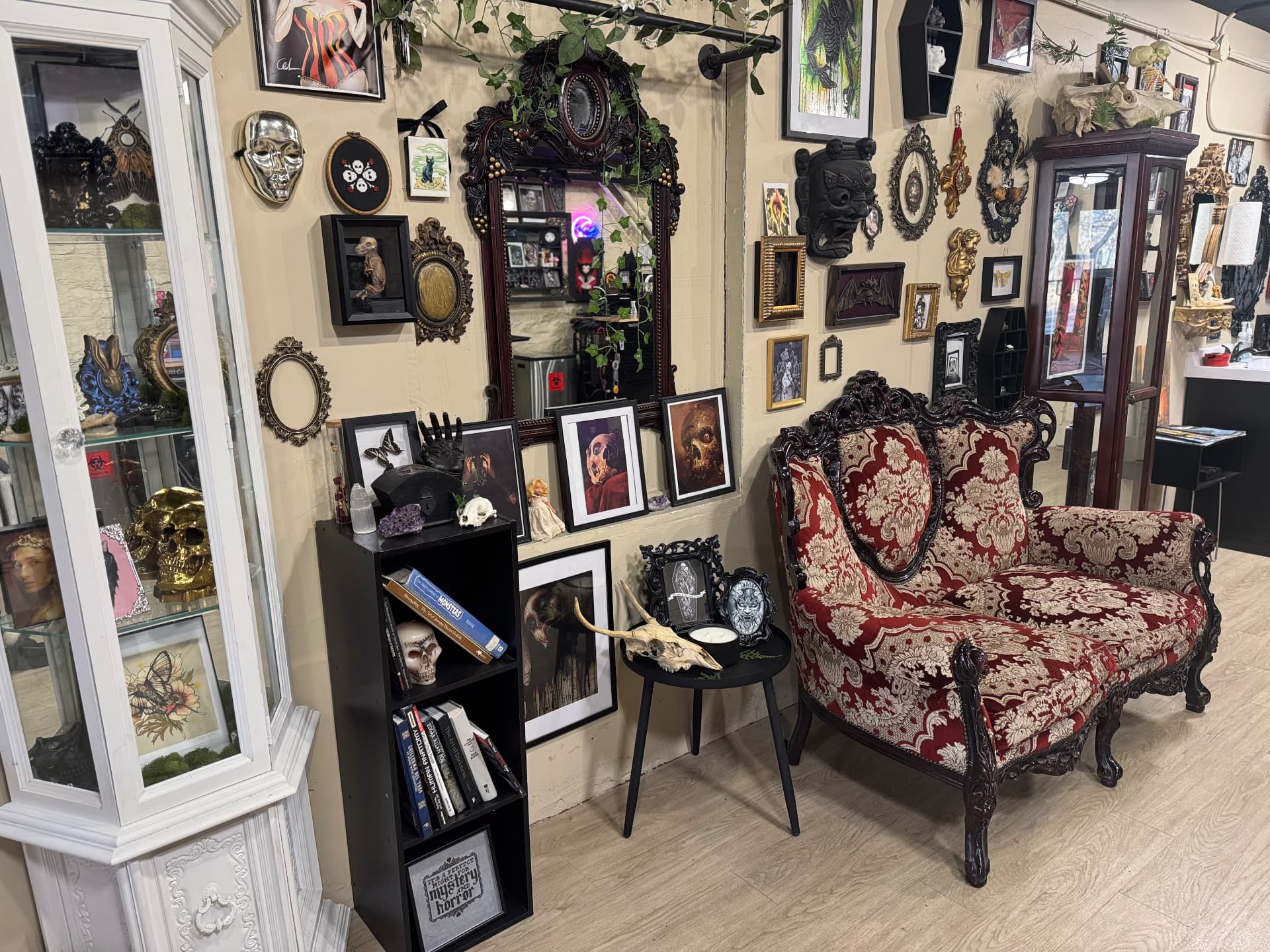 Cabinet of curiosities corner with skulls, taxidermy and antique mirrors