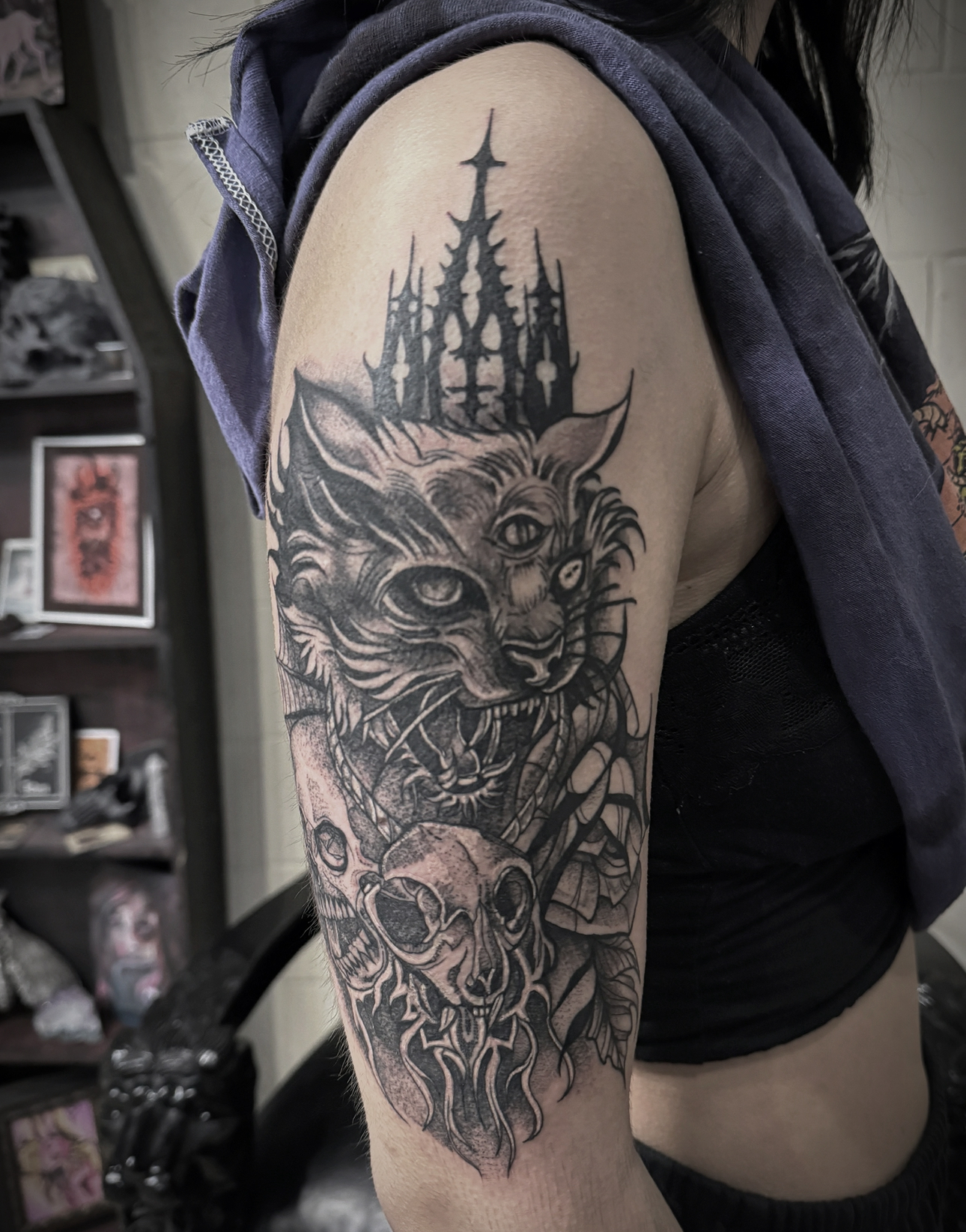 Yowling cat half sleeve with gothic cathedral spires, skulls and cobwebs