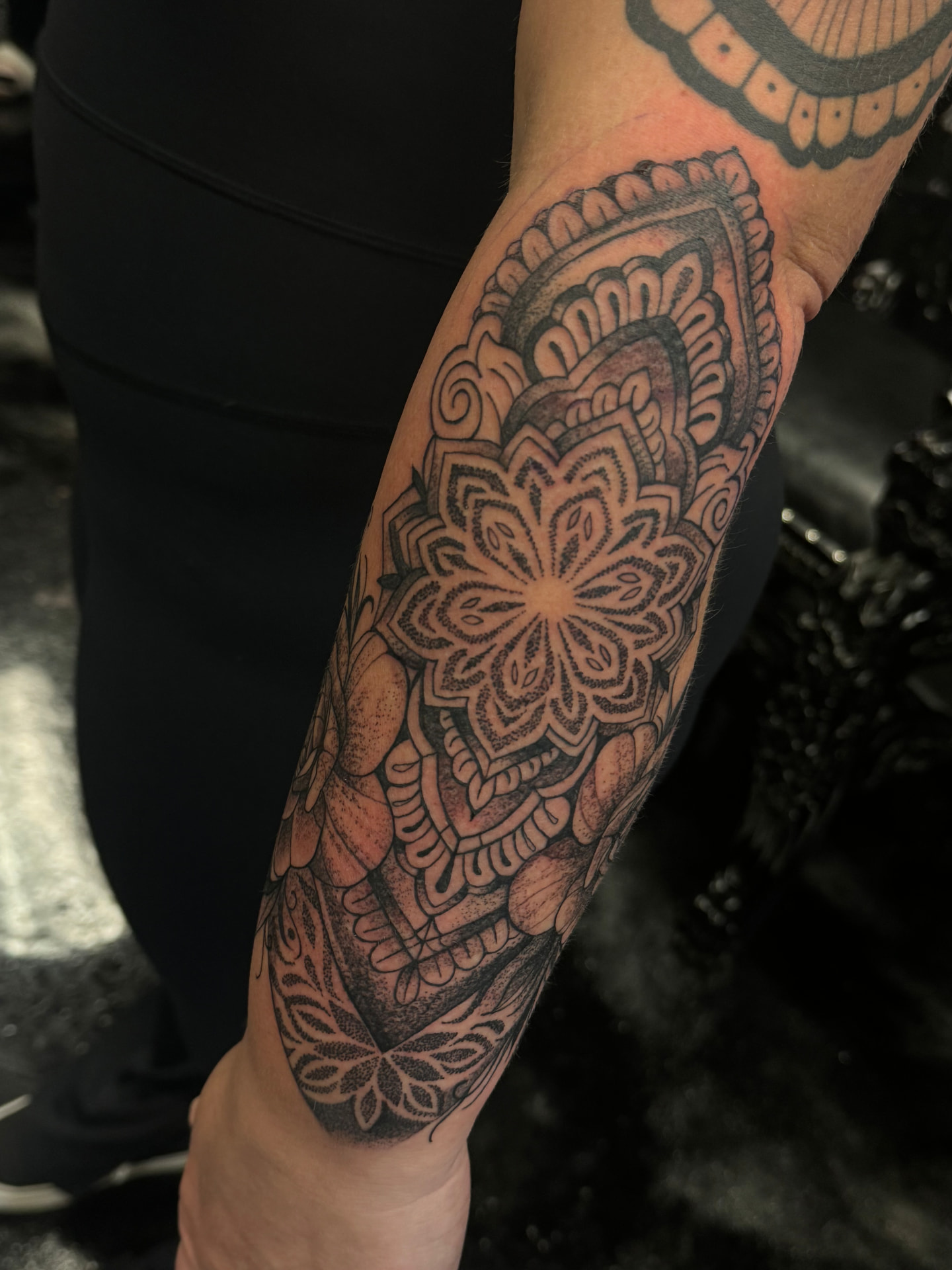 Dotwork mandala and lotus forearm sleeve with ornamental petals