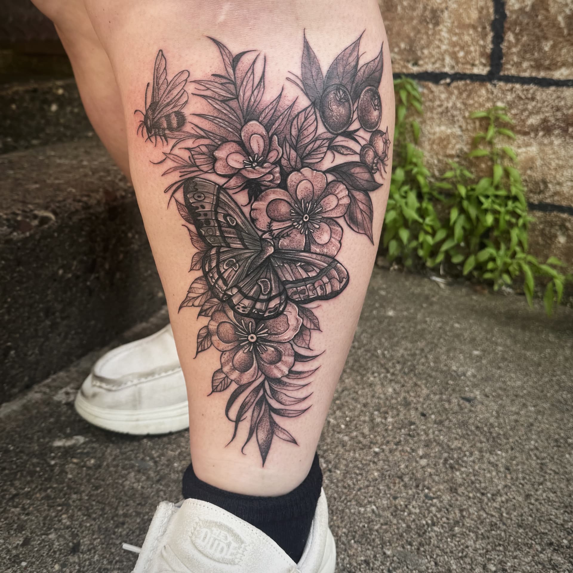 Dotwork moth, bee and blossoms calf piece in black and grey