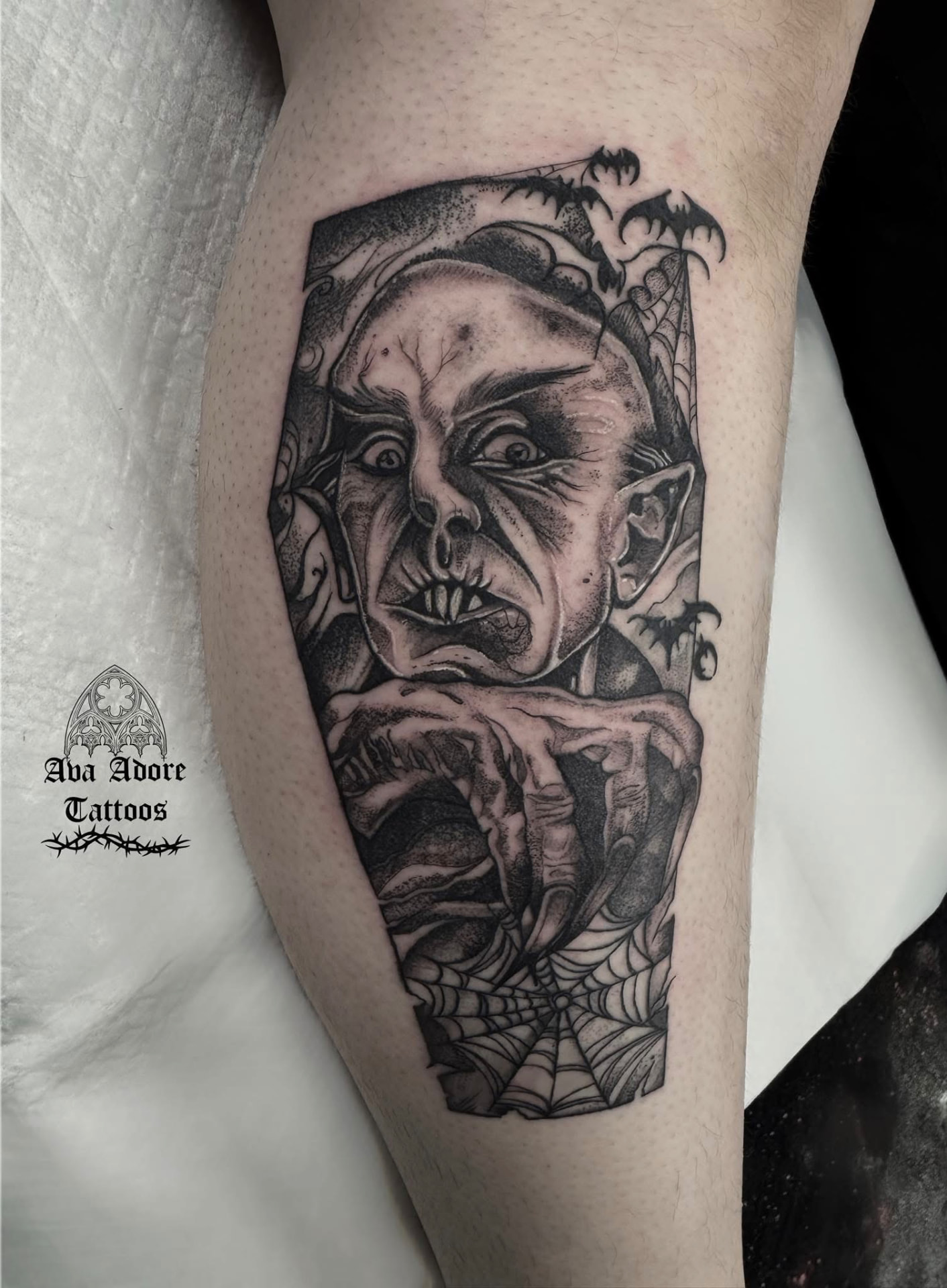 Nosferatu coffin portrait calf tattoo with bats and cobwebs