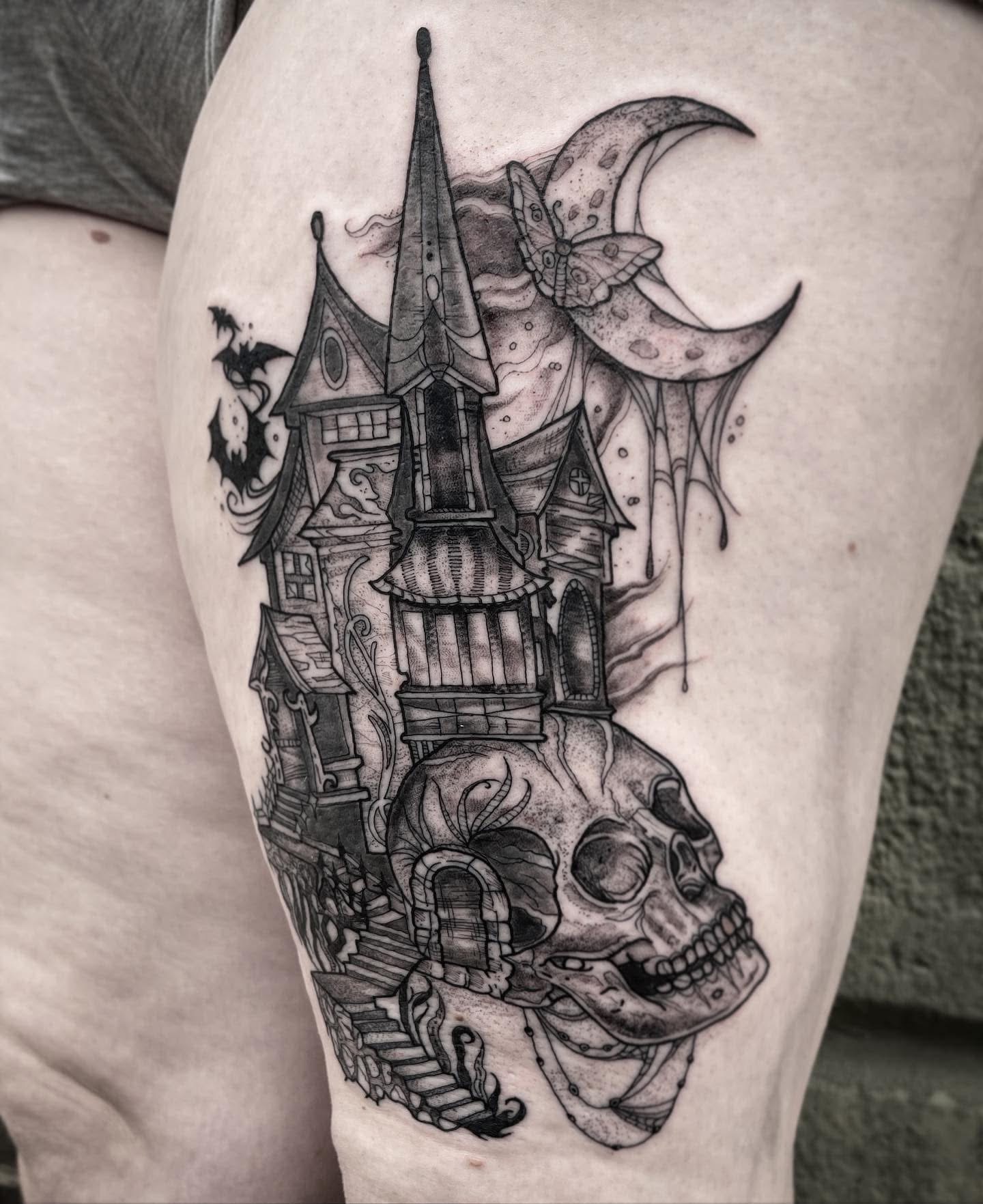 Black and grey haunted manor tattoo with gnarled trees